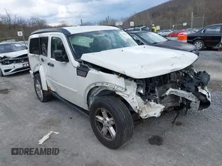 2007 Dodge Nitro SXT with VIN 1D8GU28K77W727391, listed as a IAAI auction lot 41869288 with 214,920 mi miles. Bid and sale history available at carsss.com. Image 1.
