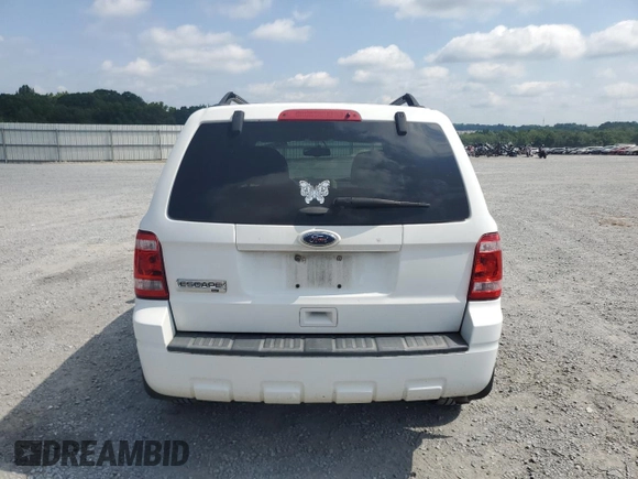 2012 Ford Escape XLT with VIN 1FMCU9D73CKC29497, listed as a Copart auction lot 63211965 with 142,134 mi miles and Salvage title. Bid and sale history available at DreamBid. Image 6.
