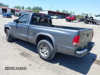 2003 Dodge Dakota with VIN 1D7FL16X53S361797, listed as a IAAI auction lot 42056555 with 243,771 mi miles and . Bid and sale history available at carsss.com. Image 3.