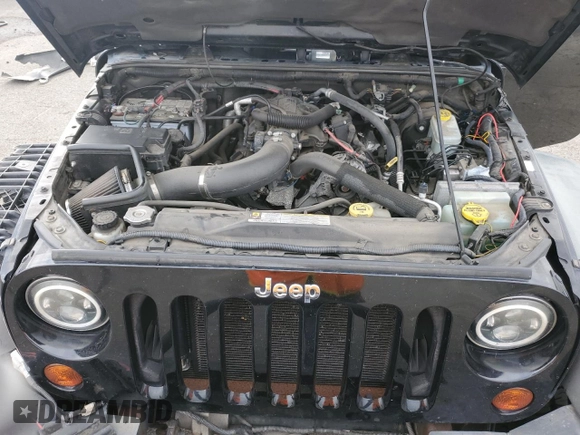 2011 Jeep Wrangler Rubicon with VIN 1J4BA6D12BL507652, listed as a Copart auction lot 69989964 with 127,493 mi miles and Salvage title. Bid and sale history available at DreamBid. Image 11.