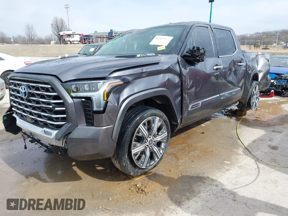 2022 Toyota Tundra Capstone Hybrid with VIN 5TFVC5DB6NX005465, listed as a IAAI auction lot 41589222 with 28,452 mi miles and . Bid and sale history available at DreamBid. Image 2.