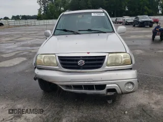 2001 Suzuki XL7 Standard z VIN JS3TX92V814116919, wystawiony jako Copart lot #72758694 z przebiegiem 185 153 mil mil oraz Szkoda całkowita • Salvage title. Historia ofert i sprzedaży dostępna na DreamBid. Obrazek 5.