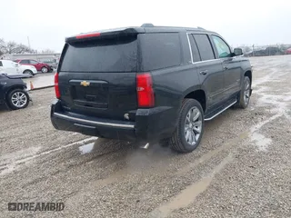 2016 Chevrolet Tahoe LTZ with VIN 1GNSKCKC2GR104305, listed as a IAAI auction lot 41697868 with 124,670 mi miles. Bid and sale history available at carsss.com. Image 4.