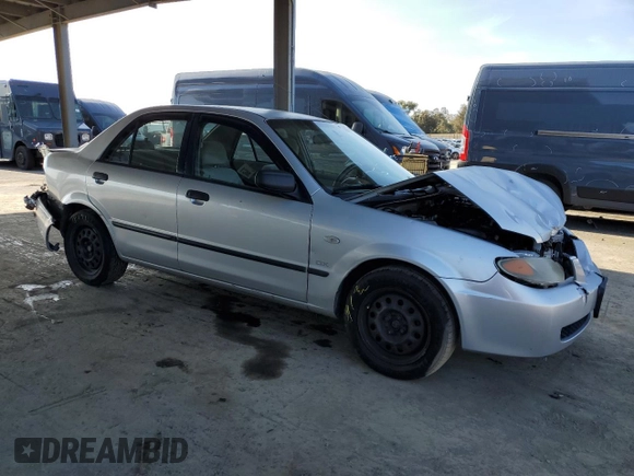 2002 Mazda Protege DX with VIN JM1BJ225120605237, listed as a Copart auction lot 49331225 with 184,556 mi miles and Salvage Title. Bid and sale history available at DreamBid. Image 4.