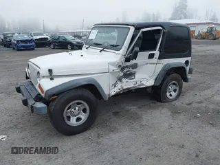 2006 Jeep Wrangler Sport Right Hand Drive with VIN 1J4F449S16P709895, listed as a IAAI auction lot 41349311 with 157,125 mi miles. Bid and sale history available at carsss.com. Image 20.