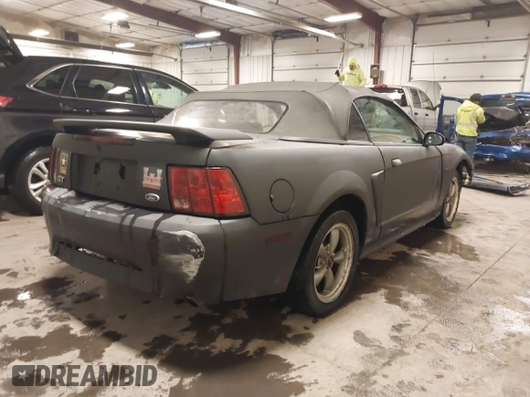 2002 Ford Mustang GT Deluxe z VIN 1FAFP45X92F176117, wystawiony jako IAAI lot #41619448 z przebiegiem 178 787 mil mil oraz . Historia ofert i sprzedaży dostępna na DreamBid. Obrazek 4.