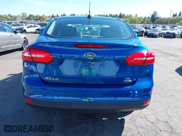 2018 Ford Focus SE z VIN 1FADP3FE4JL279265, wystawiony jako IAAI lot #42068130 z przebiegiem 43 616 mil mil oraz . Historia ofert i sprzedaży dostępna na DreamBid. Obrazek 17.