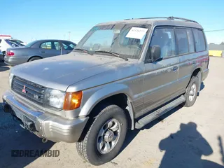1997 Mitsubishi Montero z VIN JA4MR41R3VJ006477, wystawiony jako IAAI lot #41326277 z przebiegiem 239 378 mil mil oraz . Historia ofert i sprzedaży dostępna na DreamBid. Obrazek 2.