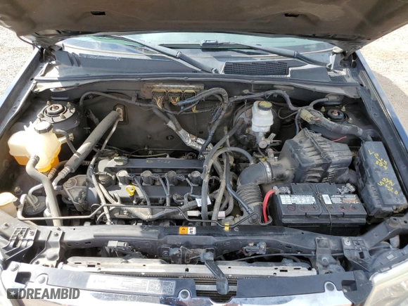 2010 Mazda Tribute Touring with VIN 4F2CY9C75AKM02945, listed as a Copart auction lot 67784674 with 134,363 mi miles and Salvage Title. Bid and sale history available at carsss.com. Image 12.