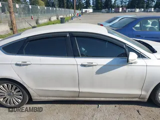2016 Ford Fusion Titanium Hybrid with VIN 3FA6P0RU2GR357739, listed as a IAAI auction lot 42120441 with 151,201 mi miles. Bid and sale history available at carsss.com. Image 13.