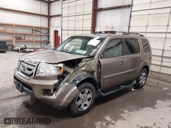 2011 Honda Pilot Touring with VIN 5FNYF4H92BB053458, listed as a IAAI auction lot 41594708 with 136,454 mi miles. Bid and sale history available at carsss.com. Image 2.