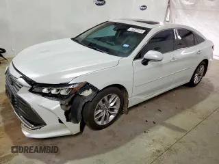 2021 Toyota Avalon XLE z VIN 4T1AZ1FB0MU060010, wystawiony jako Copart lot #56844085 z przebiegiem 115 788 mil mil oraz Czysty tytuł • Clean title. Historia ofert i sprzedaży dostępna na DreamBid. Obrazek 1.