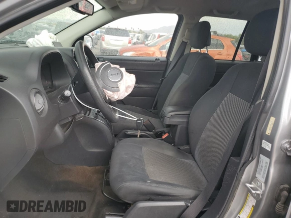 2016 Jeep Compass Sport with VIN 1C4NJCBA5GD612112, listed as a Copart auction lot 60039395 with 154,860 mi miles and Salvage title. Bid and sale history available at DreamBid. Image 7.