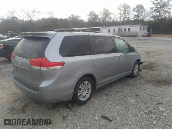 2014 Toyota Sienna XLE with VIN 5TDYK3DC0ES421501, listed as a IAAI auction lot 41672414 with 111,911 mi miles. Bid and sale history available at carsss.com. Image 4.