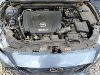 2015 Mazda 3 i Grand Touring z VIN 3MZBM1W78FM170908, wystawiony jako Copart lot #61169875 z przebiegiem 66 801 mil mil oraz Szkoda całkowita • Salvage title. Historia ofert i sprzedaży dostępna na DreamBid. Obrazek 11.