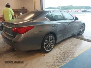 2014 Infiniti Q50 Premium z VIN JN1BV7AR7EM696486, wystawiony jako IAAI lot #41976047 z przebiegiem 145 000 mil mil oraz . Historia ofert i sprzedaży dostępna na DreamBid. Obrazek 4.