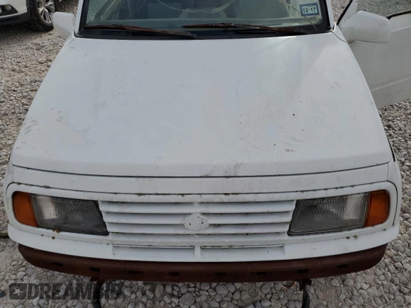 1994 Suzuki Sidekick z VIN 2S3TA01C8R6408593, wystawiony jako Copart lot #65011514 z przebiegiem 248 814 mil mil oraz Tytuł czysty. Historia ofert i sprzedaży dostępna na DreamBid. Obrazek 11.