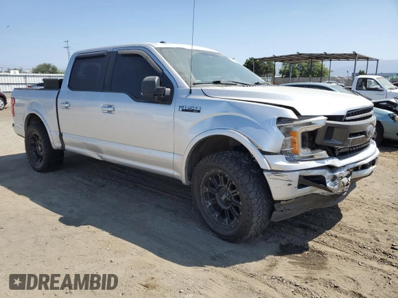 2018 Ford F-150 XL with VIN 1FTEW1CGXJFB40297, listed as a Copart auction lot 69642404 with 92,561 mi miles and Salvage title. Bid and sale history available at DreamBid. Image 4.