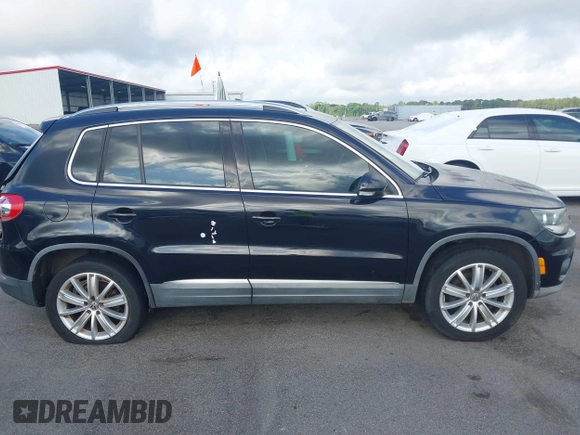 2012 Volkswagen Tiguan SE z VIN WVGAV7AX7CW504391, wystawiony jako IAAI lot #42240604 z przebiegiem 180 330 mil mil oraz . Historia ofert i sprzedaży dostępna na DreamBid. Obrazek 13.