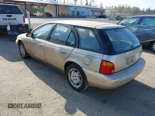 1996 Saturn SW z VIN 1G8ZK8270TZ292057, wystawiony jako IAAI lot #42100826 z przebiegiem 207 561 mil mil oraz . Historia ofert i sprzedaży dostępna na DreamBid. Obrazek 3.