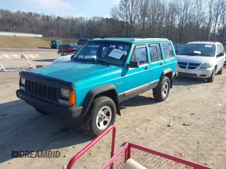 1996 Jeep Cherokee Sport z VIN 1J4FJ68S2TL103997, wystawiony jako IAAI lot #41517835 z przebiegiem 175 560 mil mil oraz . Historia ofert i sprzedaży dostępna na DreamBid. Obrazek 2.