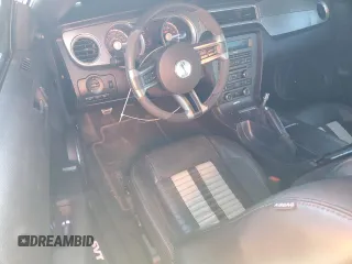 2010 Ford Mustang GT500 with VIN 1ZVBP8JS1A5105926, listed as a Copart auction lot 77398504 with 63,699 mi miles and Salvage title. Bid and sale history available at DreamBid. Image 8.