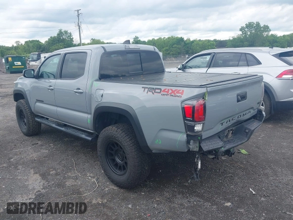 2021 Toyota Tacoma SR with VIN 5TFCZ5AN3MX258746, listed as a IAAI auction lot 42252967 with 62,095 mi miles and . Bid and sale history available at DreamBid. Image 3.