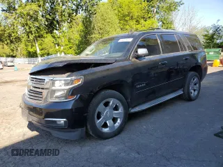 2015 Chevrolet Tahoe LTZ with VIN 1GNSCCKC5FR159617, listed as a Copart auction lot 55649425 with 157,351 mi miles and Salvage title. Bid and sale history available at DreamBid. Image 1.