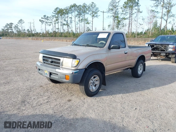 1999 Toyota Tacoma with VIN 4TAPM62NXXZ439318, listed as a IAAI auction lot 41721442 with 299,876 mi miles and . Bid and sale history available at DreamBid. Image 2.