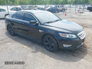 2012 Ford Taurus SHO z VIN 1FAHP2KT6CG143490, wystawiony jako IAAI lot #42235776 z przebiegiem 125 671 mil mil oraz . Historia ofert i sprzedaży dostępna na DreamBid. Obrazek 1.