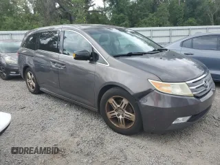 2012 Honda Odyssey Touring with VIN 5FNRL5H94CB102177, listed as a Copart auction lot 55942185 with 179,418 mi miles and Salvage Title. Bid and sale history available at DreamBid. Image 4.