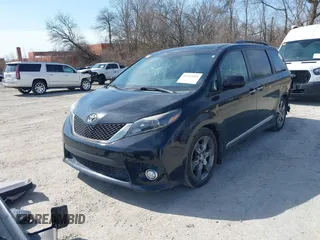 2015 Toyota Sienna SE with VIN 5TDXK3DC9FS652765, listed as a IAAI auction lot 41723922 with 105,679 mi miles. Bid and sale history available at carsss.com. Image 2.