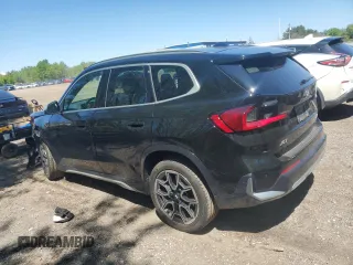 2023 BMW X1 xDrive28i with VIN WBX73EF04P5X86962, listed as a Copart auction lot 57575815 with 95,965 mi miles and Salvage title. Bid and sale history available at DreamBid. Image 2.