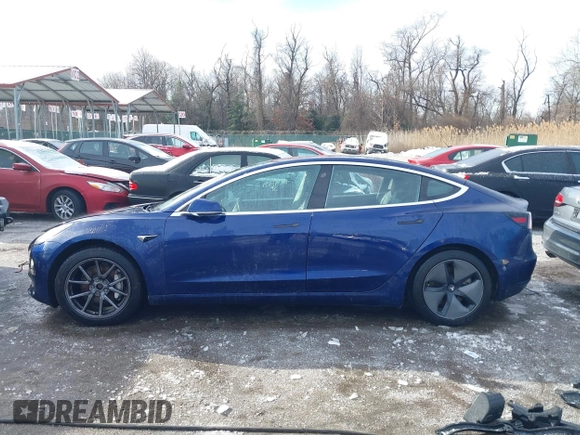 2018 Tesla Model 3 Long Range Battery with VIN 5YJ3E1EB8JF115138, listed as a IAAI auction lot 41343399 with 62,351 mi miles and . Bid and sale history available at DreamBid. Image 15.