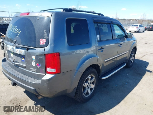2011 Honda Pilot Touring with VIN 5FNYF4H95BB090892, listed as a IAAI auction lot 41878404 with 131,757 mi miles. Bid and sale history available at carsss.com. Image 4.