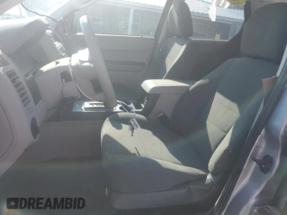 2010 Ford Escape XLS with VIN 1FMCU0C73AKA52802, listed as a Copart auction lot 60100185 with 141,541 mi miles and Clean title. Bid and sale history available at DreamBid. Image 7.