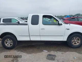 2001 Ford F-150 XL z VIN 1FTZX17281NB02781, wystawiony jako IAAI lot #42377688 z przebiegiem 180 830 mil mil oraz . Historia ofert i sprzedaży dostępna na DreamBid. Obrazek 13.