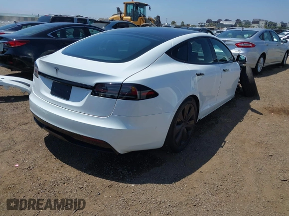 2023 Tesla Model S with VIN 5YJSA1E51PF499919, listed as a IAAI auction lot 42459166 with 6,612 mi miles and . Bid and sale history available at DreamBid. Image 4.