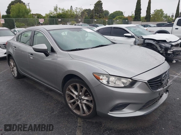 2014 Mazda 6 i Touring with VIN JM1GJ1V60E1141831, listed as a IAAI auction lot 42131200 with 86,597 mi miles and . Bid and sale history available at DreamBid. Image 1.