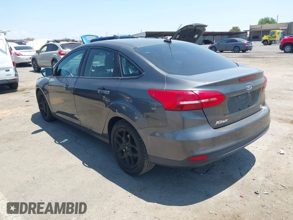 2016 Ford Focus SE z VIN 1FADP3F25GL329217, wystawiony jako IAAI lot #42461772 z przebiegiem 85 070 mil mil oraz . Historia ofert i sprzedaży dostępna na DreamBid. Obrazek 3.
