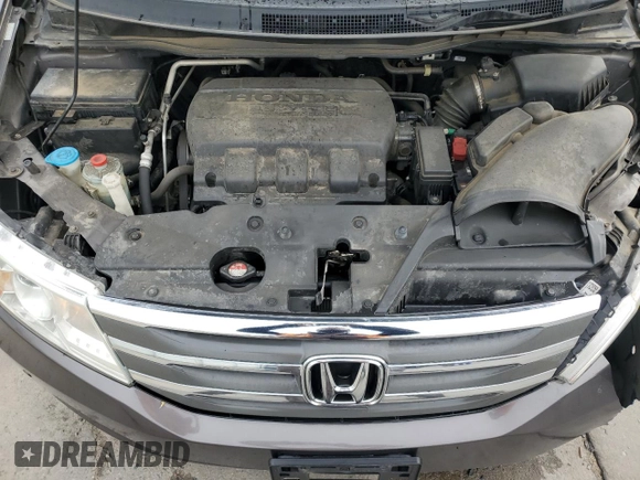 2012 Honda Odyssey Touring with VIN 5FNRL5H94CB109257, listed as a Copart auction lot 59636075 with 107,543 mi miles and Salvage title. Bid and sale history available at DreamBid. Image 12.