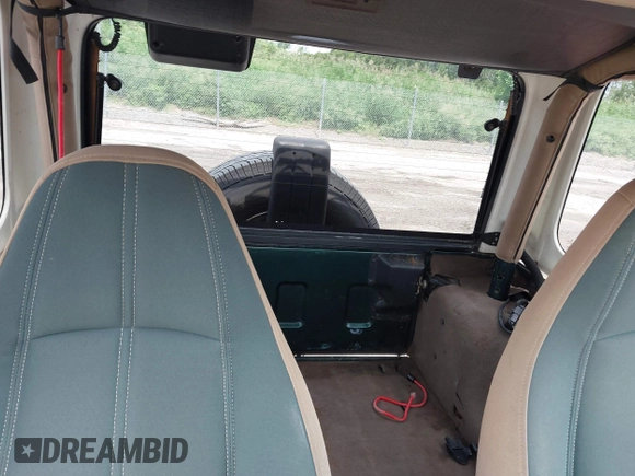 1999 Jeep Wrangler Sahara z VIN 1J4FY49S7XP442719, wystawiony jako IAAI lot #42506510 z przebiegiem 188 175 mil mil oraz . Historia ofert i sprzedaży dostępna na DreamBid. Obrazek 8.