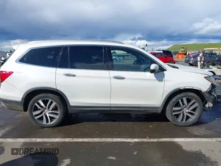 2017 Honda Pilot Elite with VIN 5FNYF6H06HB041609, listed as a IAAI auction lot 41804477 with 134,535 mi miles and . Bid and sale history available at DreamBid. Image 14.