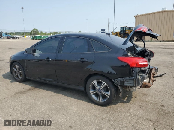 2018 Ford Focus SE z VIN 1FADP3F2XJL228407, wystawiony jako Copart lot #59254415 z przebiegiem 75 241 mil mil oraz Szkoda całkowita • Salvage title. Historia ofert i sprzedaży dostępna na DreamBid. Obrazek 2.