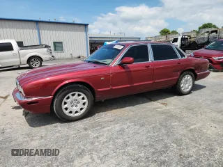 2001 Jaguar XJ with VIN SAJDA14CX1LF30943, listed as a Copart auction lot 64380685 with 95,625 mi miles and Salvage title. Bid and sale history available at DreamBid. Image 1.