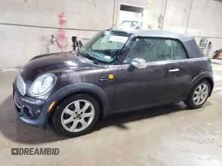 2015 MINI Convertible with VIN WMWZN3C59FT266929, listed as a Copart auction lot 57264985 with 110,200 mi miles and Salvage title. Bid and sale history available at DreamBid. Image 1.