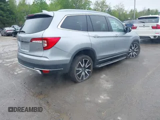 2020 Honda Pilot Touring 8-Passenger z VIN 5FNYF6H91LB042626, wystawiony jako IAAI lot #42249440 z przebiegiem 57 429 mil mil oraz . Historia ofert i sprzedaży dostępna na DreamBid. Obrazek 4.