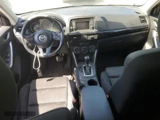 2014 Mazda CX-5 Touring with VIN JM3KE4CY9E0415402, listed as a Copart auction lot 56576114 with 181,719 mi miles and Salvage Title. Bid and sale history available at carsss.com. Image 8.