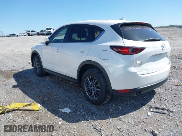 2021 Mazda CX-5 Touring z VIN JM3KFBCM2M1395663, wystawiony jako IAAI lot #41948073 z przebiegiem 47 029 mil mil oraz . Historia ofert i sprzedaży dostępna na DreamBid. Obrazek 3.
