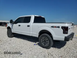 2015 Ford F-150 XLT w/HD Payload Pkg with VIN 1FTFW1EG6FFA02457, listed as a Copart auction lot 52121515 with 242,747 mi miles and Salvage Title. Bid and sale history available at carsss.com. Image 2.